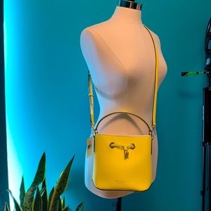 Make me an offer 
KATE SPADE YELLOW LEATHER BUCKET BAG WITH TOP HANDLE